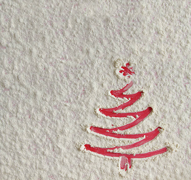 istock Christmas tree on flour background. White flour looks like snow. 635847364