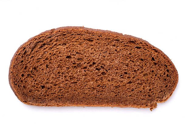 Vista superior do pão de brread marrom no fundo branco - foto de acervo