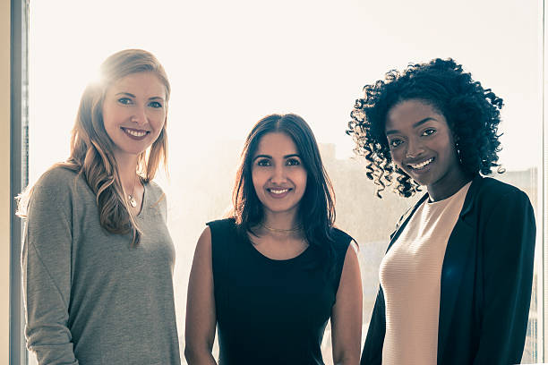 istock Three confident multi racial businesswoman smiling 635850600