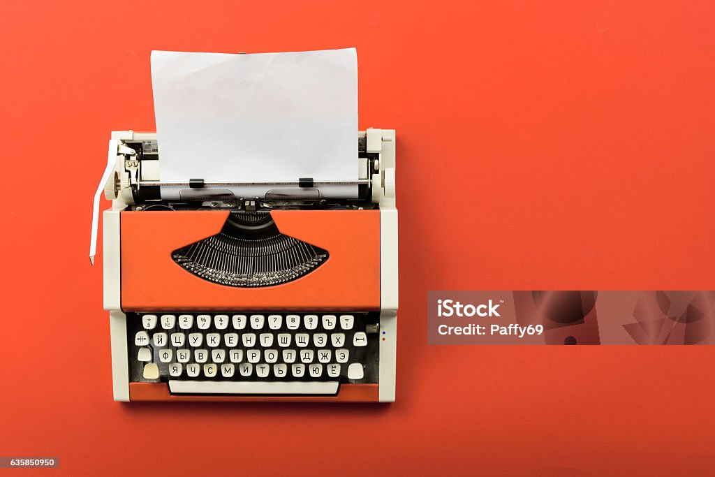 Red Vintage Typewriter With White Blank Paper Sheet Stock Photo