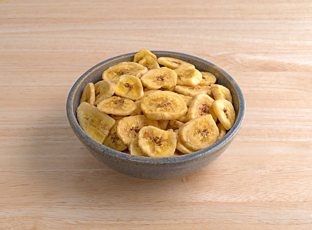 istock Dried bananas in an old bowl on a table 635851216