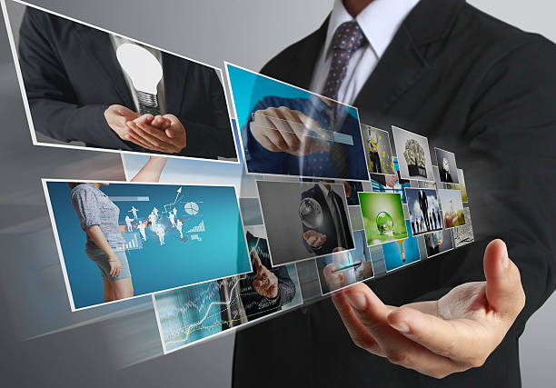 istock businessmen and Reaching images streaming 635851610
