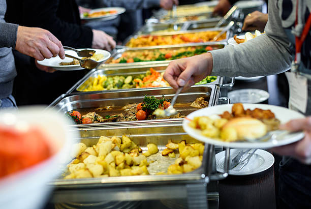 Cuisine Culinary Buffet Dinner Catering Dining Food Celebration Cuisine Culinary Buffet Dinner Catering Dining Food Celebration Party Concept. Group of people in all you can eat catering buffet food indoor in luxury restaurant with meat and vegetables. food service occupation stock pictures, royalty-free photos & images