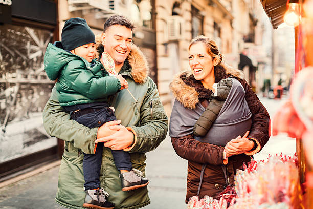 istock Mother And Father Buying Sweets To Their Son 635864258