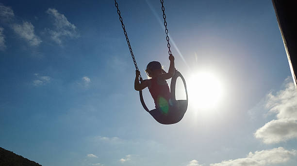 istock Swinging at the playpark 635864358