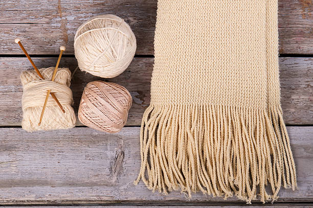 istock Winter beige knitted scarf. 635864622