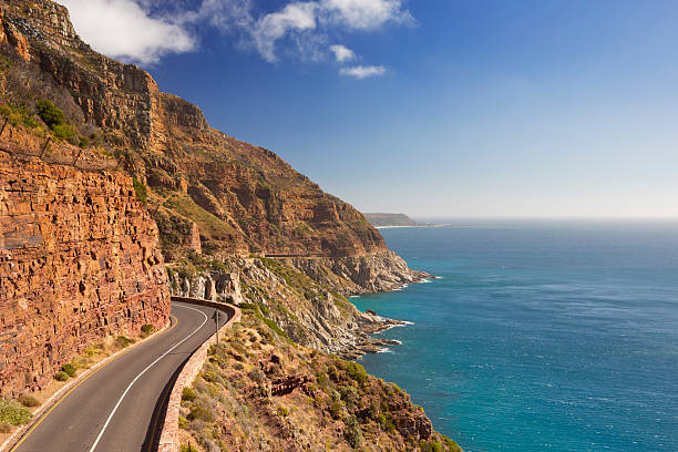 Chapman's Peak Drive near Cape Town in South Africa The Chapman's Peak Drive on the Cape Peninsula near Cape Town in South Africa on a bright and sunny afternoon. cape peninsula photos stock pictures, royalty-free photos & images