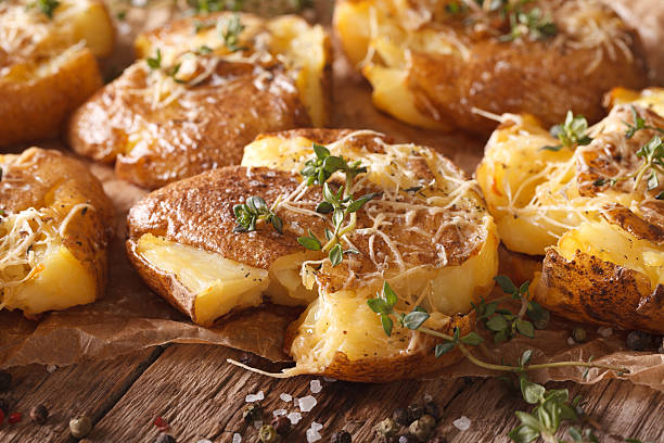 istock Australian baked crash hot potatoes with thyme close-up. horizontal 635871412