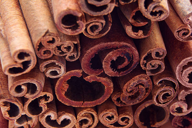 istock heap of cinnamon sticks as a background 635876514