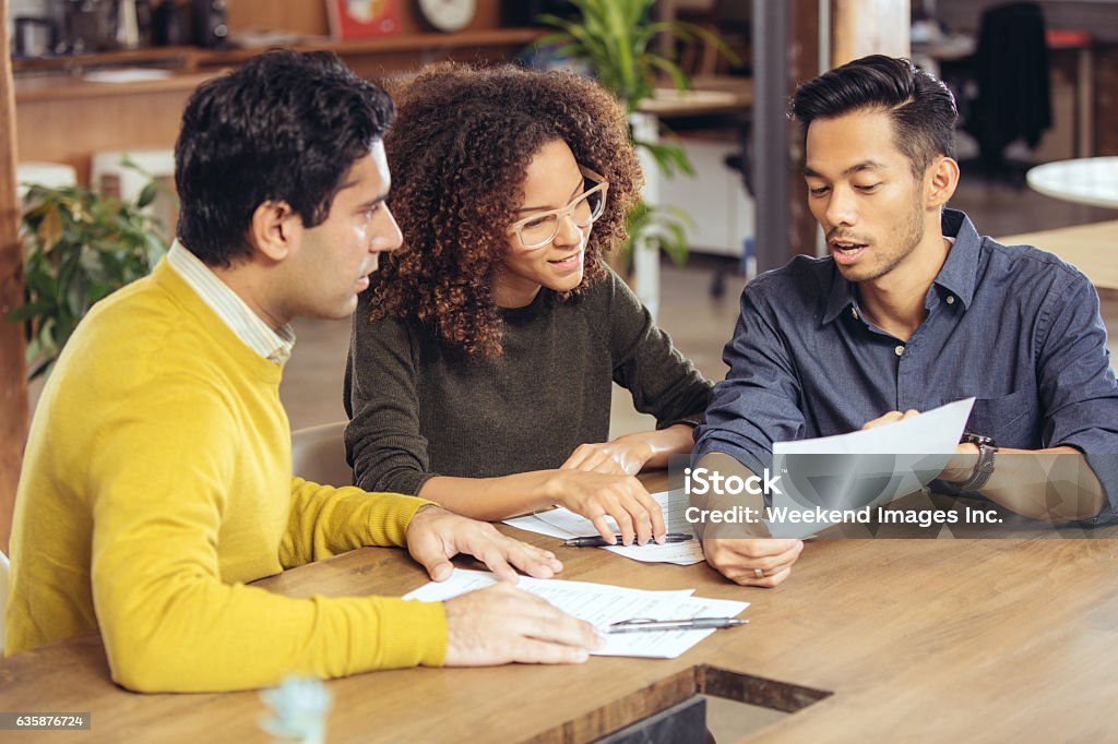 Better mortgage rate Couple on meeting with financial advisor Meeting Stock Photo