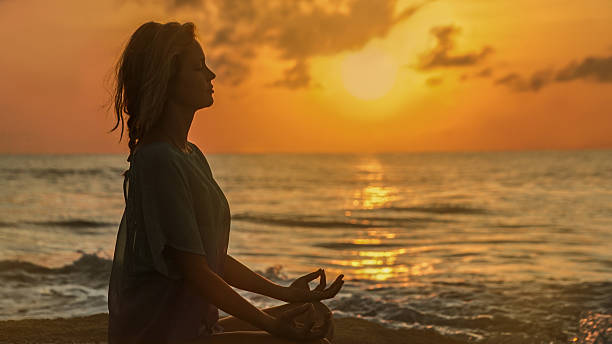 istock Yoga on the beach 635877354