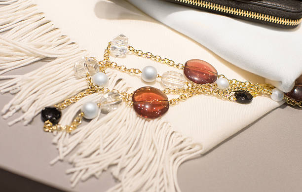 istock Woman accessories on a white scarf 635877952