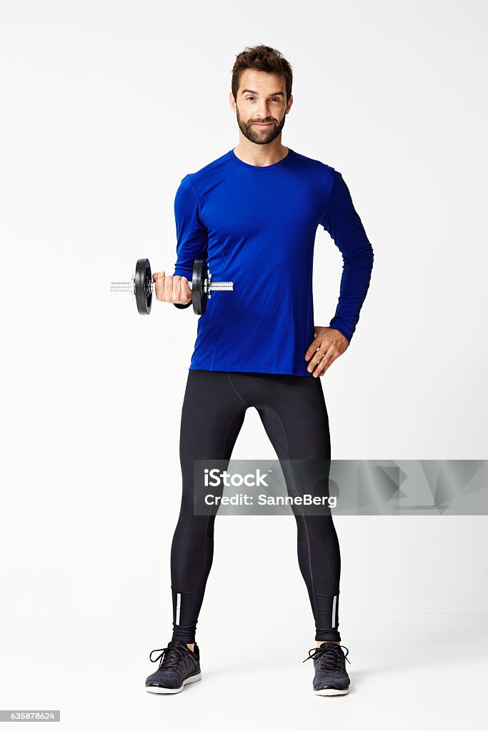 Dumb bell dude Dumb bell lifting dude in studio Men Stock Photo