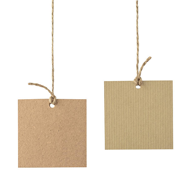 Blank cardboard labels tied with rope isolated. Blank cardboard labels hang on the rope isolated on white price tag photos stock pictures, royalty-free photos & images