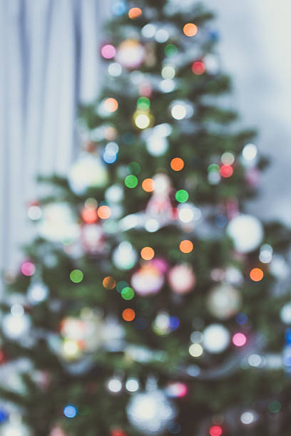 istock Christmas tree out of focus, blurred lights background. Vintage looking. 635885458