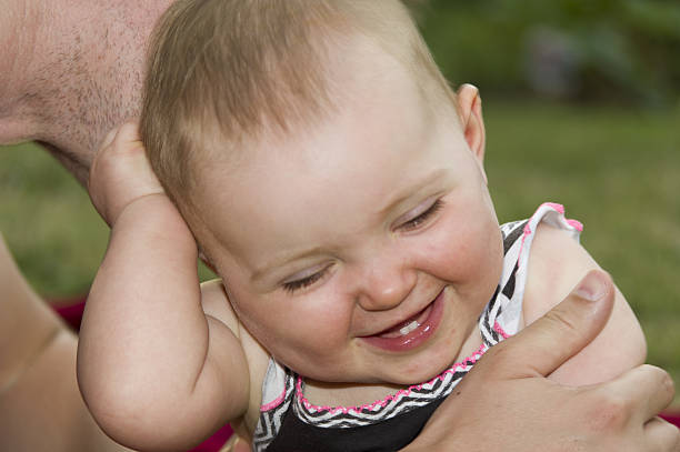 istock Baby girl laughing 635886180