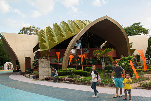 Durian Structure in People's Park of Davao Davao, Philippines - December 9, 2016: Durian Structure in People's Park of Davao, the building serves as the office of the park. Here we can see people as park goer like the family at the right portion of the picture. davao city stock pictures, royalty-free photos & images