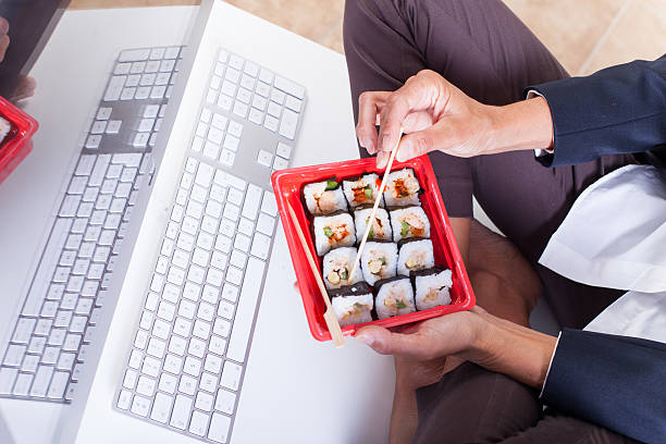 woman who eats sushi in the office