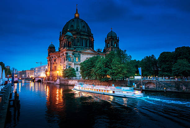 Berlin Cathedral with excursion boat on Spree river, Berlin, Germany