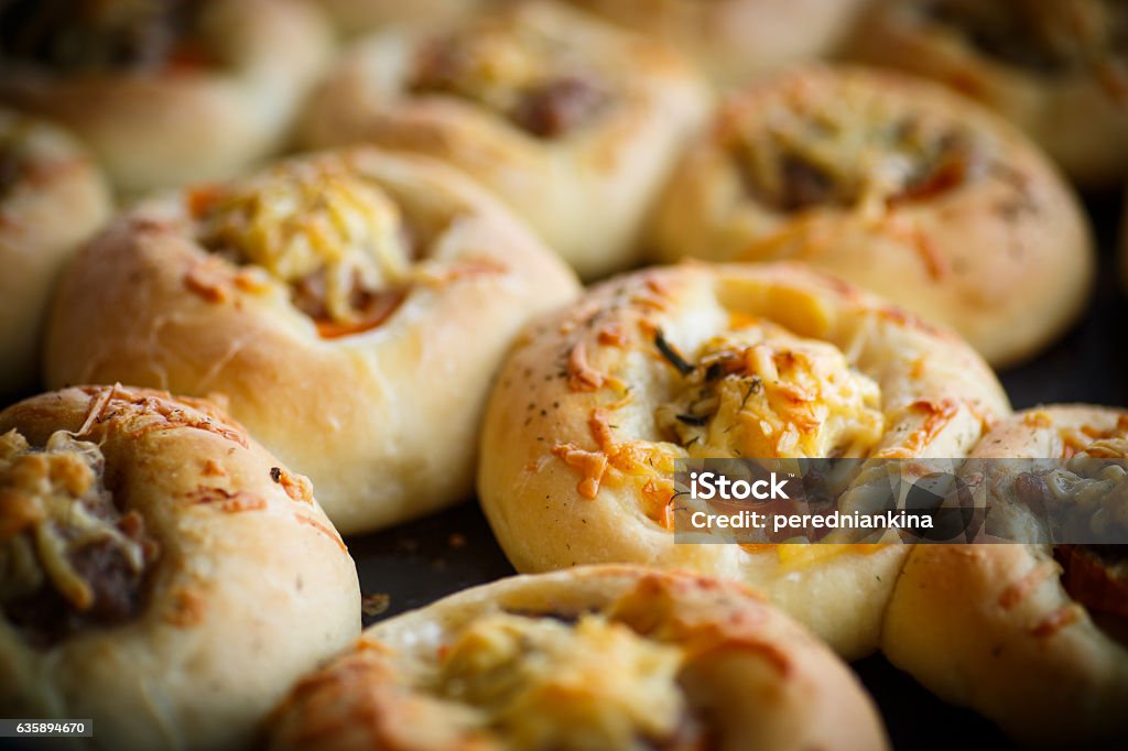 baked open pies with meat baked open pies with meat, tomato and cheese Appetizer Stock Photo