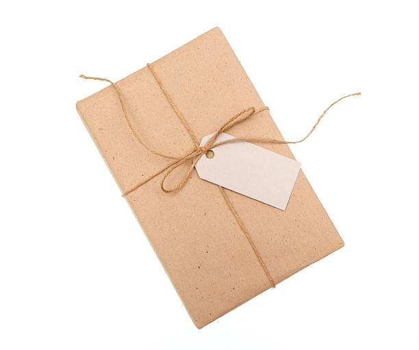 istock kraft paper gift box with a label on white background 635895464