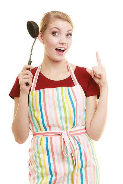 istock housewife or cook chef in kitchen apron with ladle 635899242