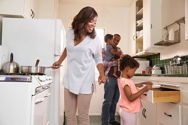 istock Family At Home Preparing Meal In Kitchen Together 635899690
