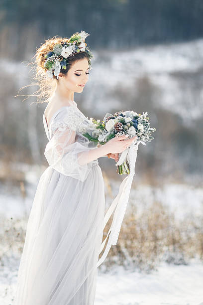 istock Beautiful bride admiring wedding bouquet. 635901030
