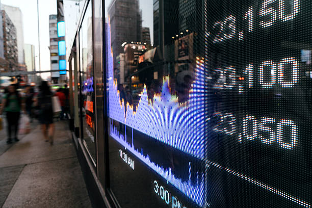 istock display stock market numbers and graph 635902568