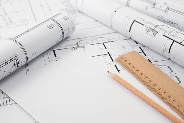 istock Blueprints and Blueprint Rolls with Pencil 635904172