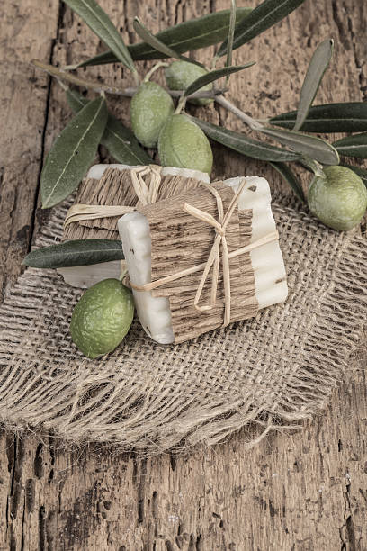 istock Olive oil soap bars on wooden table 635905062