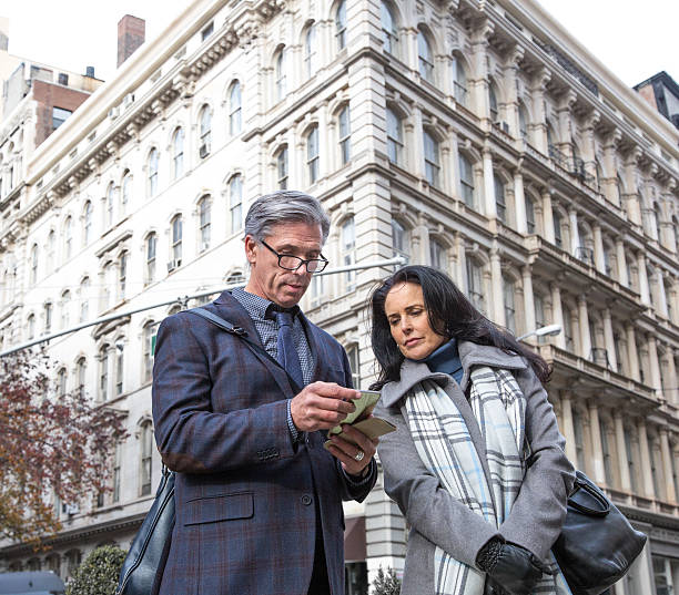 istock Mature Business Man using Cell Phone in City 635905078