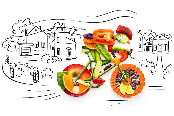 Healthy food concept of a cyclist riding a bike made of fresh vegetables and fruits, on sketchy background.