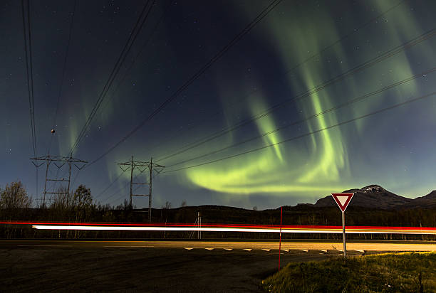 istock The Northern Lights followed by a light trail 635910136