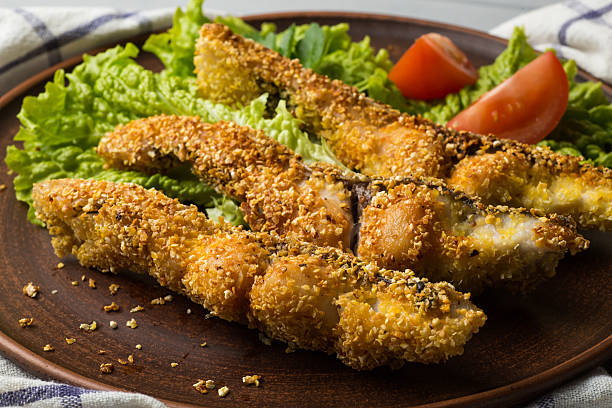 istock Tasty baked fish on plate table close-up 635910774