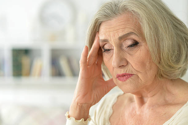 istock senior woman with thoughtful 635911290