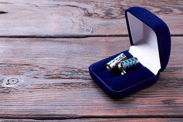 istock Cufflinks in velvet blue box. 635915284