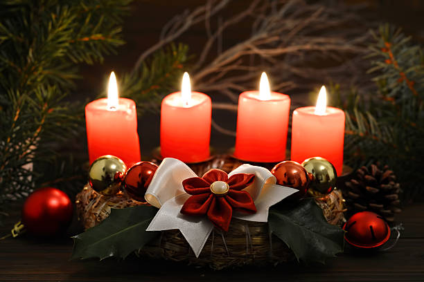 istock Christmas time: Four burning candles on Advent wreath 635916372