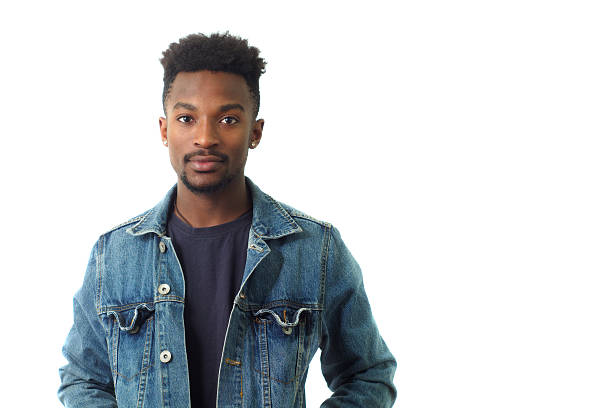 istock young man portrait wearing blue jeans posing in white studio 635921144