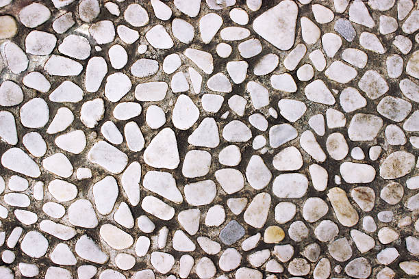 istock Decorative stone wall texture of the small boulders as backgroun 635922140