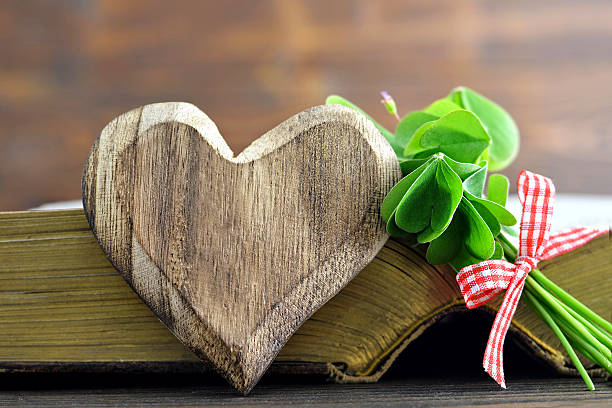 istock Wooden heart, bouquet and old book 635922160