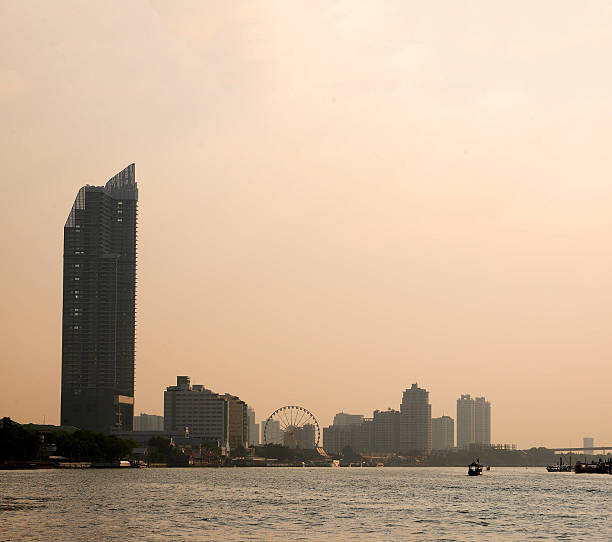 istock Bangkok Chao Phraya riverside scenery with ferris wheel 635922480