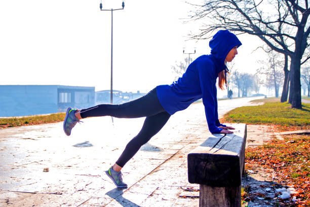 istock Push ups or press ups exercise by young woman 635922908