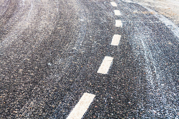istock bend on a slippery frozen road in winter 635923498