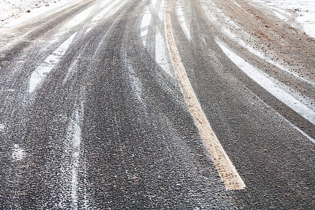istock snowy slippery road in winter 635923554