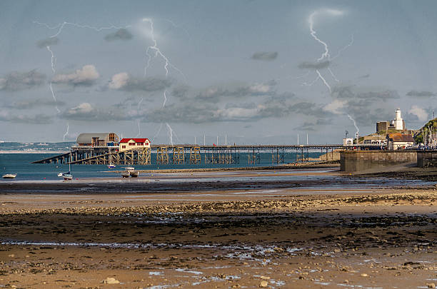 istock Mumbles pier with lightening in the background 635925848