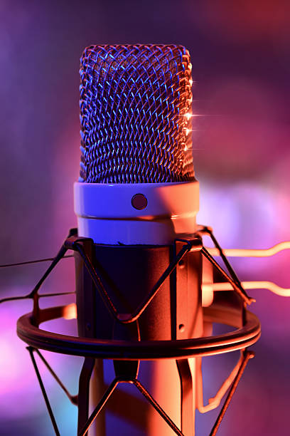 istock Close up studio condenser microphone and equipment live recordin 635925998