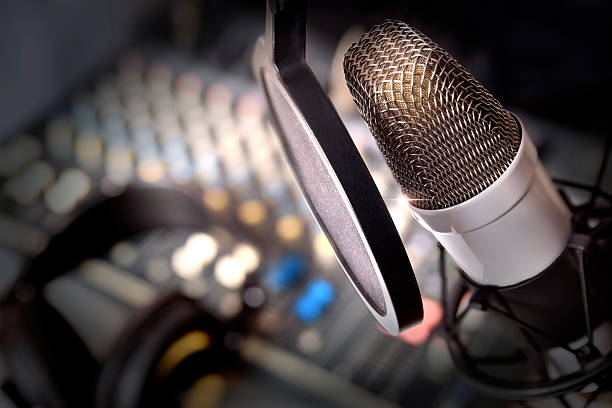 Recording equipment in studio Recording equipment in studio. Studio microphone with headphones and mixer background. Elevated view radio stock pictures, royalty-free photos & images