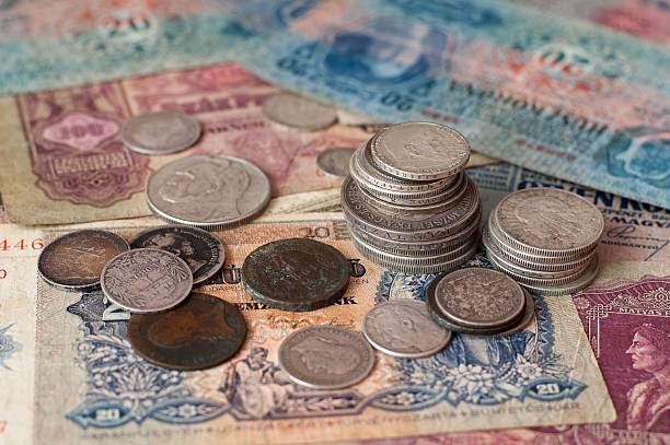 istock The old coins and banknotes. 635926362