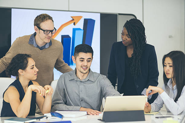 istock Ethnic male business leader presenting ideas to his team 635932676